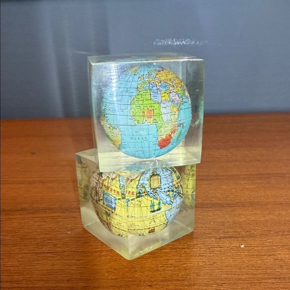 vintage lucite or acrylic paperweight featuring a miniature world globe